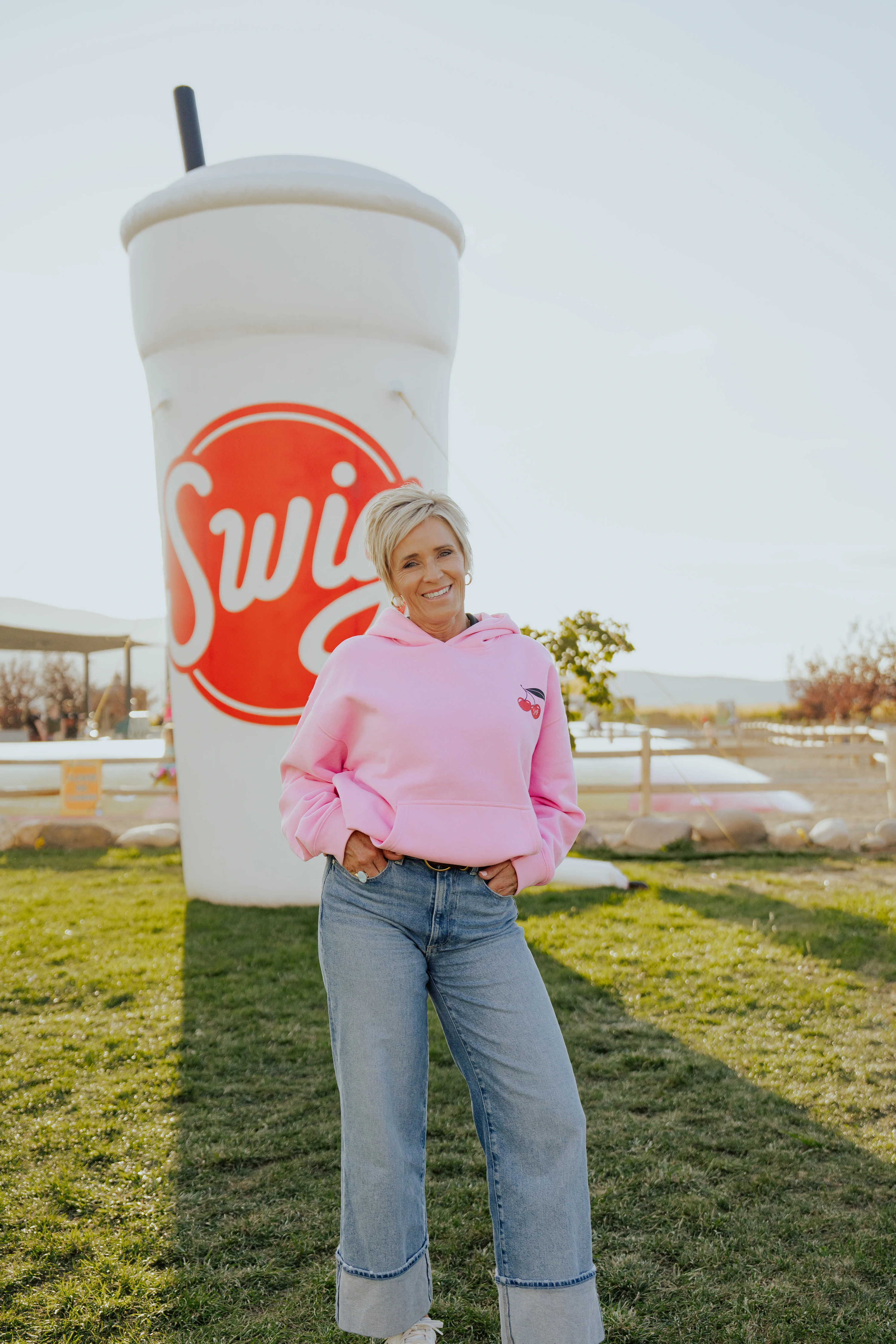 Swig founder Nicole Robison wearing a pink Save the Cups sweatshirt